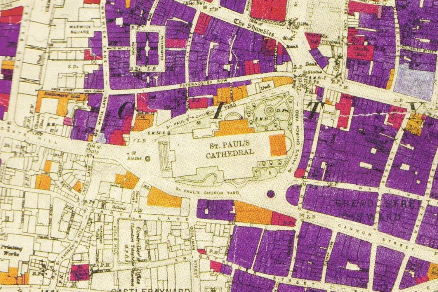 A bomb damage map of the City of London around St Paul's Cathedral, with most of the surrounding blocks coloured purple for damaged beyond repair