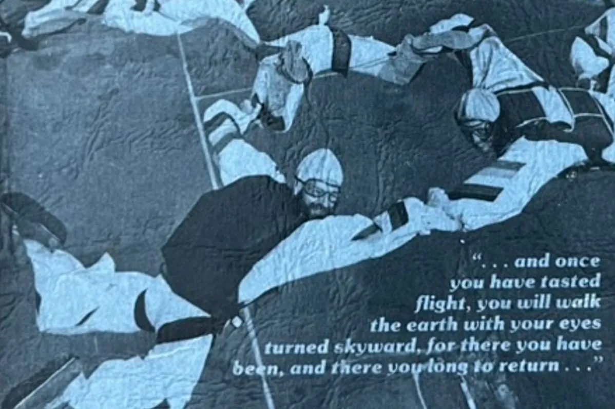 The back cover, a photograph of skydivers linked in formation, with the quotation: and once you have tasted flight, you will walk the earth with your eyes turned skyward